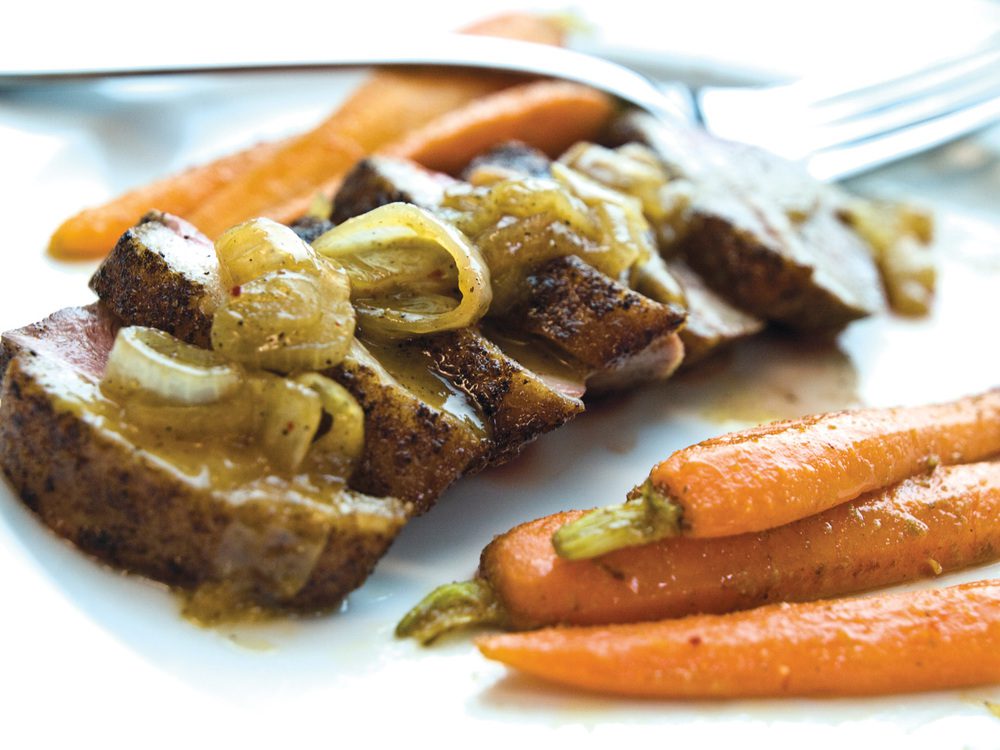 Spice Crusted Duck breast with orange honey glaze and cumin scented carrots